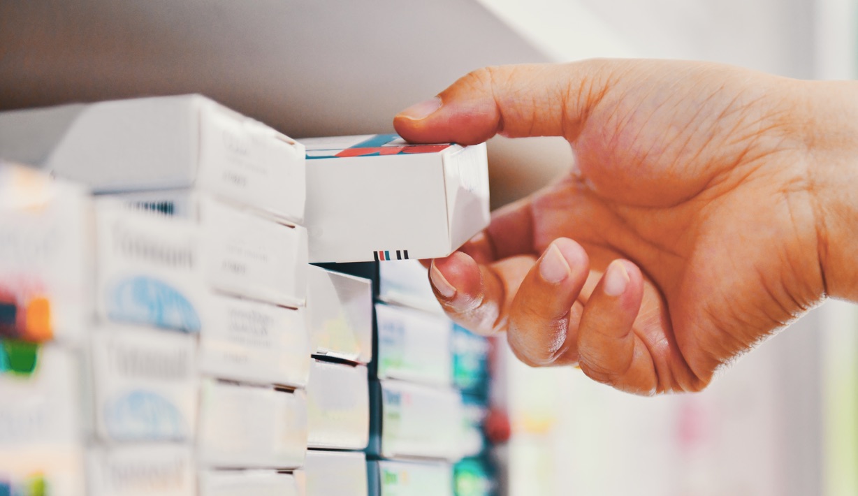 Pharmacist Grabbing Prescription Medication