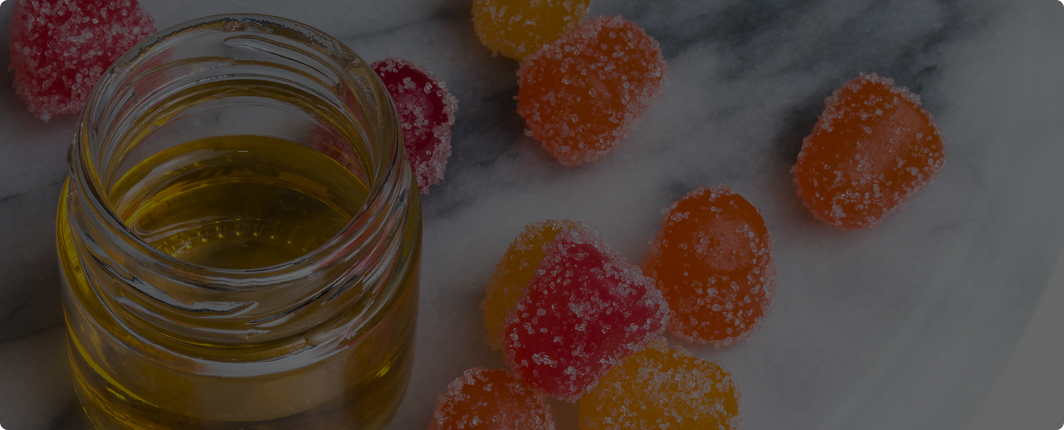 Jar of cannabis edibles on a dark background